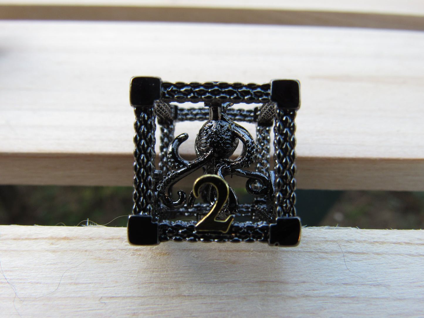 Black and Gold Caged Octopus Hollow Dice