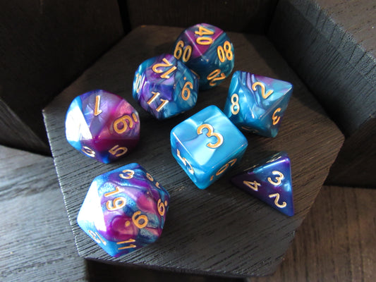 Set of colorful polyhedral dice on a wooden surface