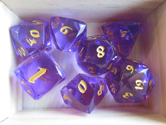 Purple polyhedral dice set with gold numbers in a wooden box gem gemstone cut faceted resin dice