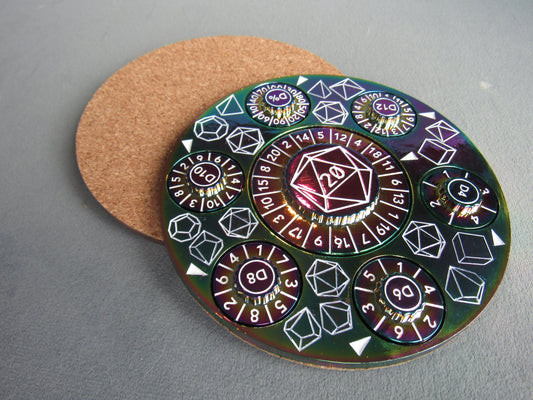 Circular die with various polyhedral dice designs on a gray surface rainbow plated dungeons and dragons