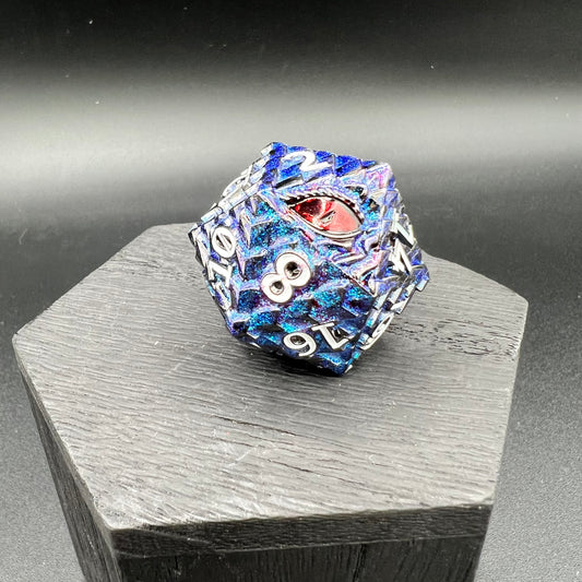 metal dice with blue and purple dragon scale patterns on a wooden stand against a dark background