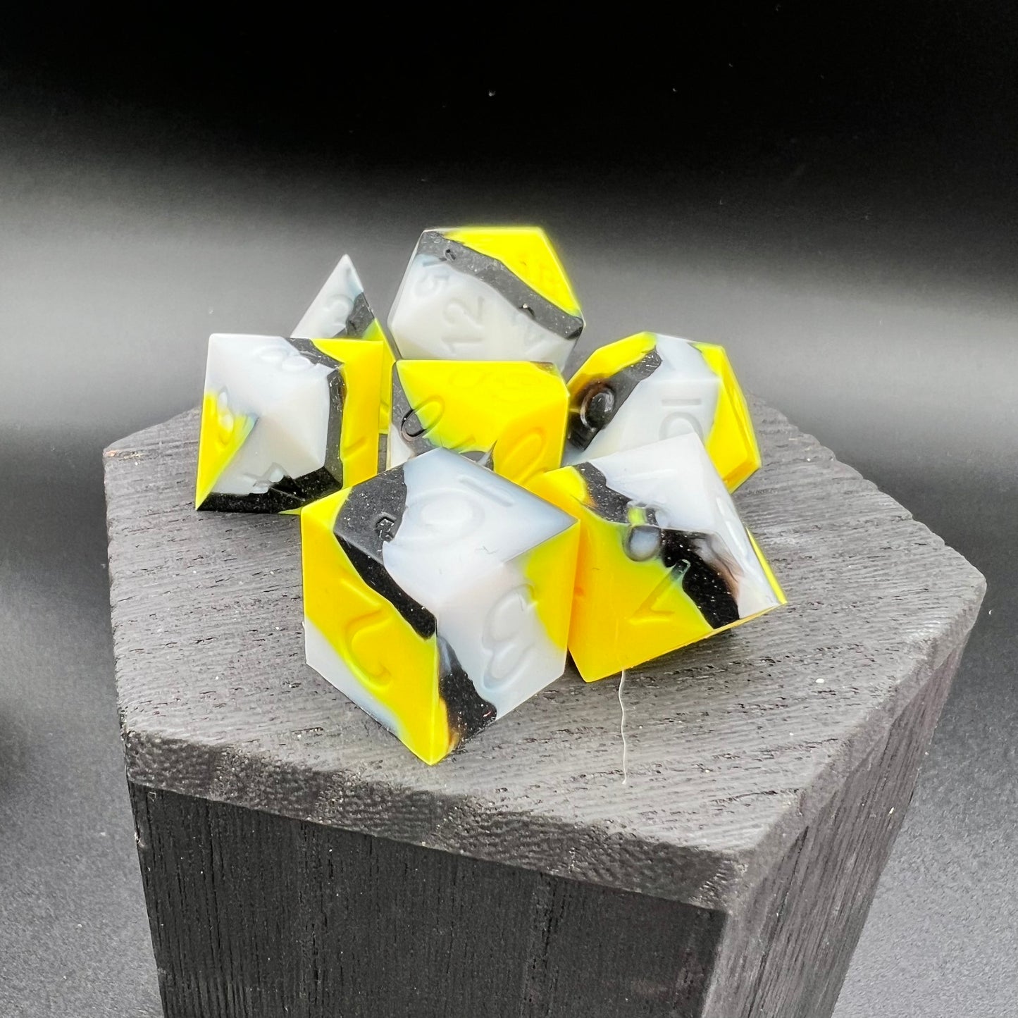 Yellow, White, and Black Silicone Dice