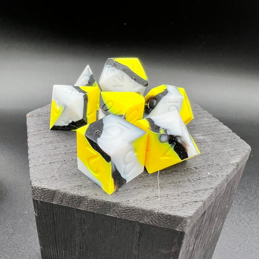 Yellow, White, and Black Silicone Dice