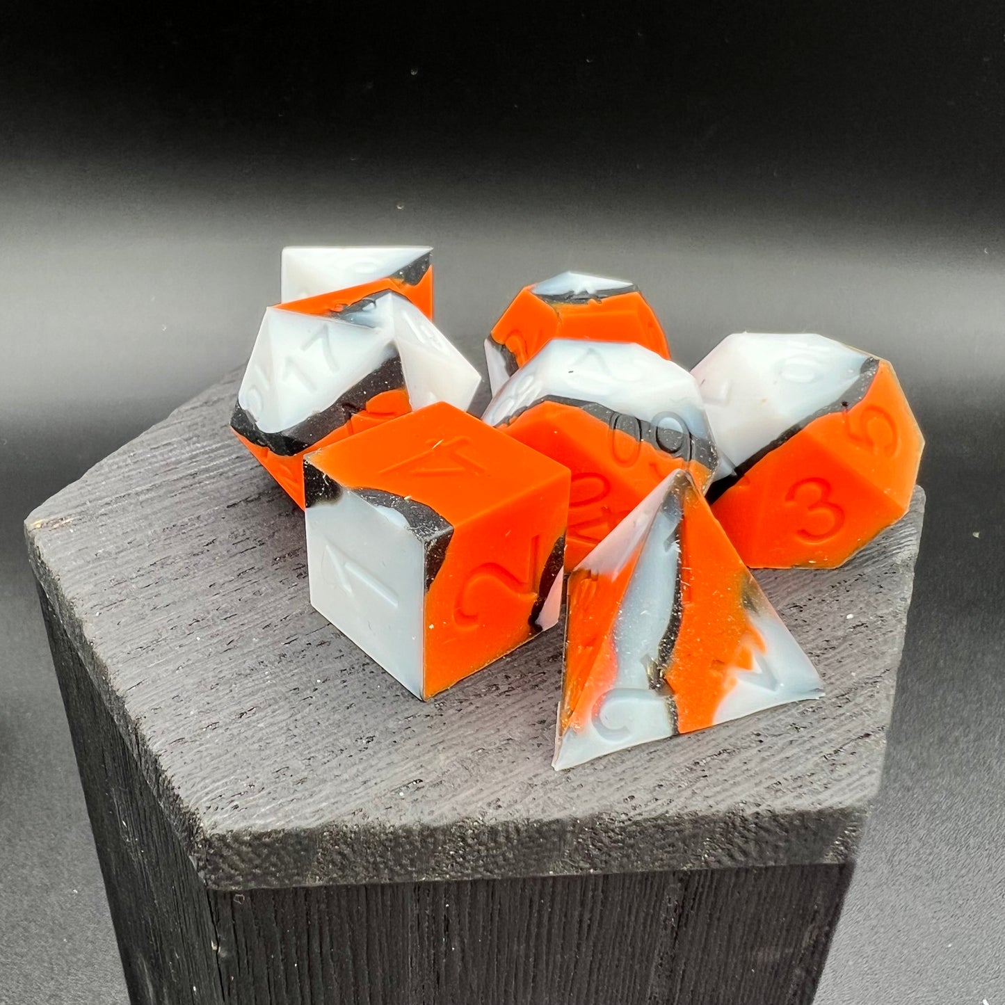 Orange, White, and Black Silicone Dice