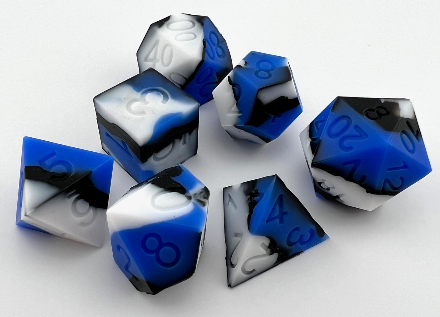 Blue, White, and Black Silicone Dice