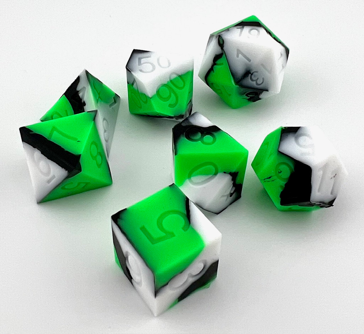 Green, White, and Black Silicone Dice