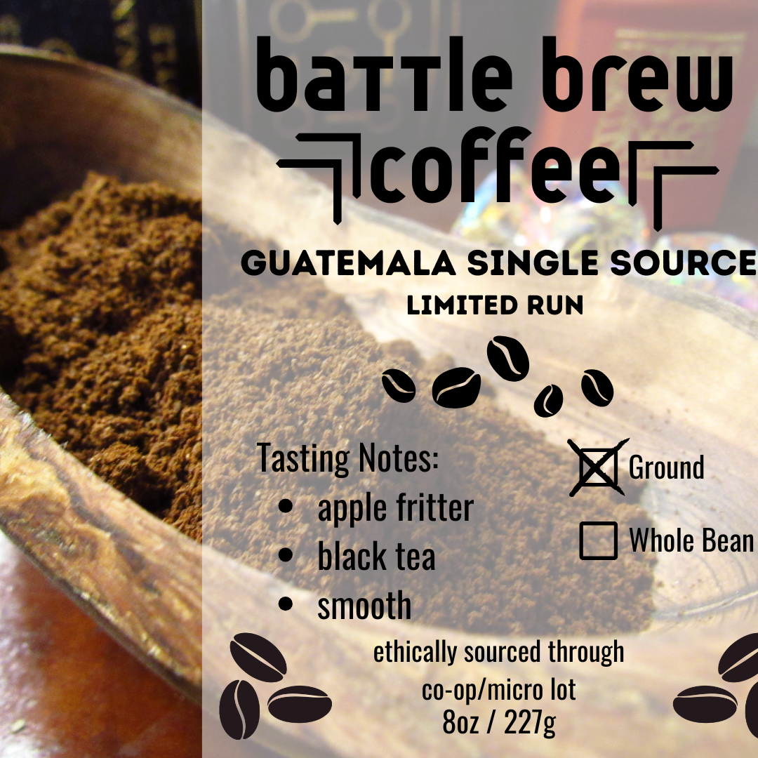 Battle Brew Coffee Guatemala single source coffee packaging with ground coffee in a scoop.
