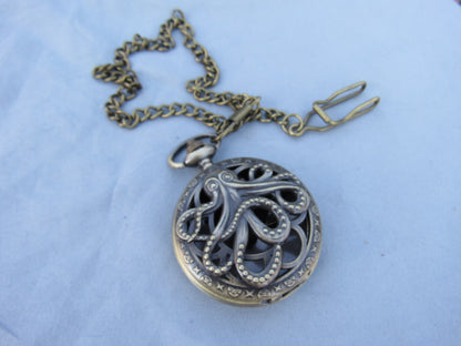 Tiny Dice in Antique Brass Octopus Pocket Watch Case