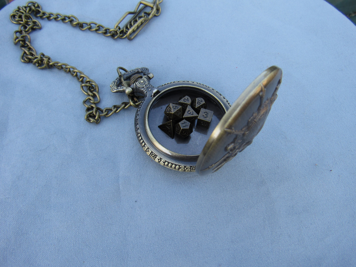 Tiny Dice in Skull Pocket Watch Case