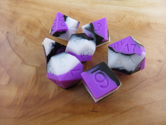 Purple, White, and Black Silicone Dice