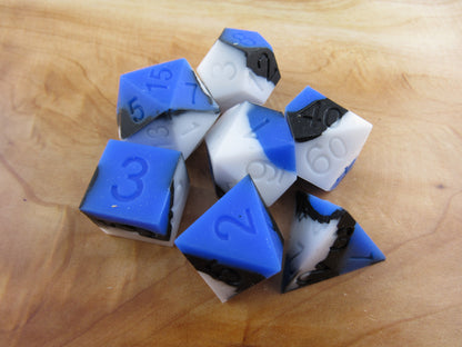 Blue, White, and Black Silicone Dice