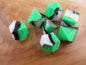 Green, White, and Black Silicone Dice