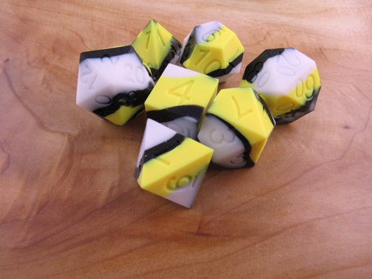 Yellow, White, and Black Silicone Dice