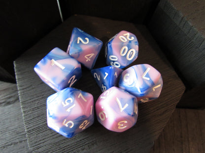 Set of colorful polyhedral dice on a dark surface