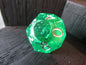 Green polyhedral dice with white numbers on a dark wooden surface gelatinous cube