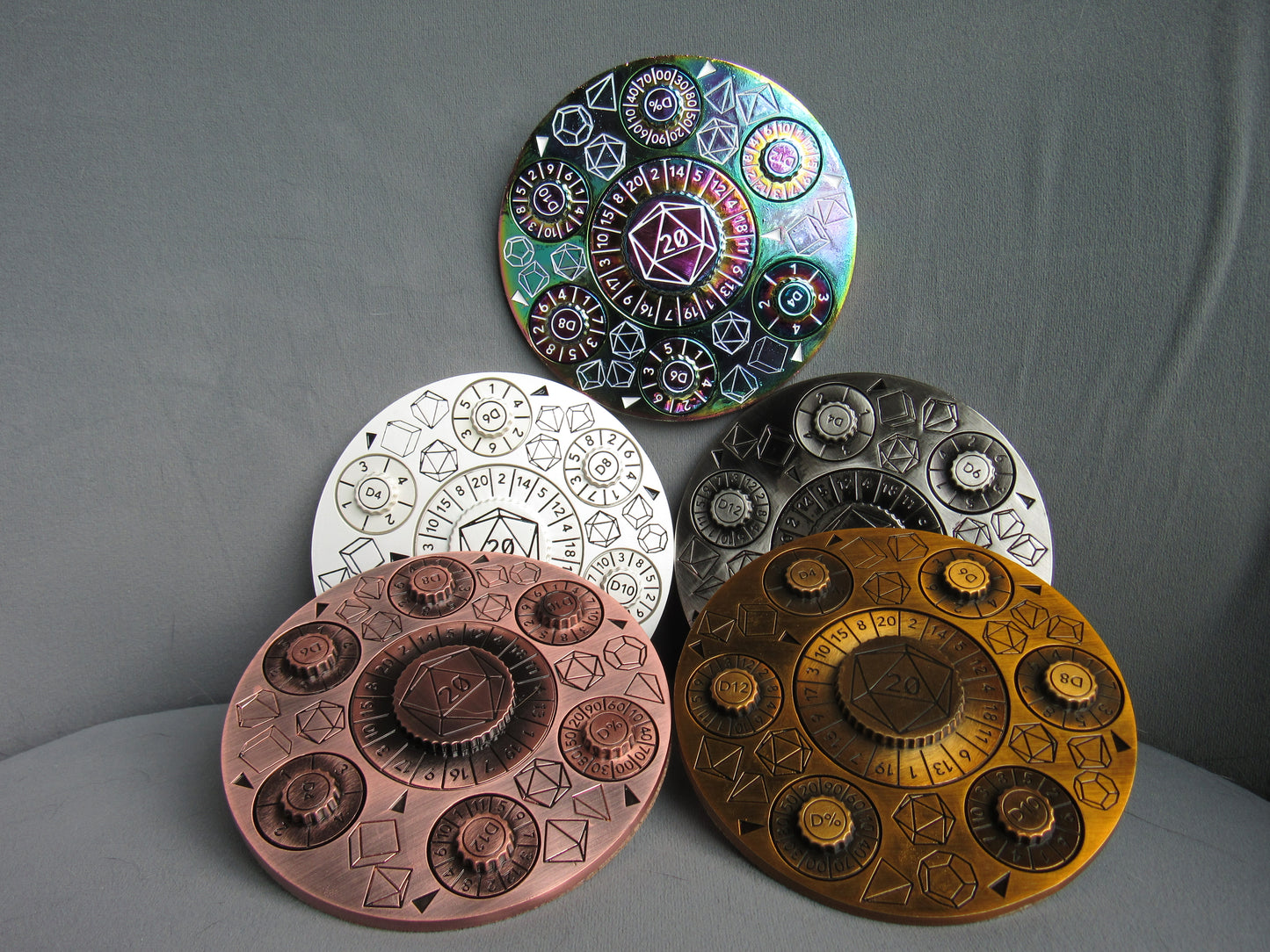 Five round metallic coins with intricate designs on a gray background, dice, dnd, dungeons and dragons