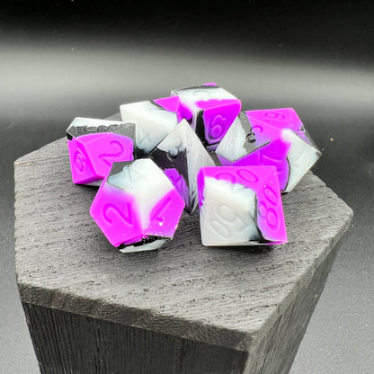 Purple, White, and Black Silicone Dice