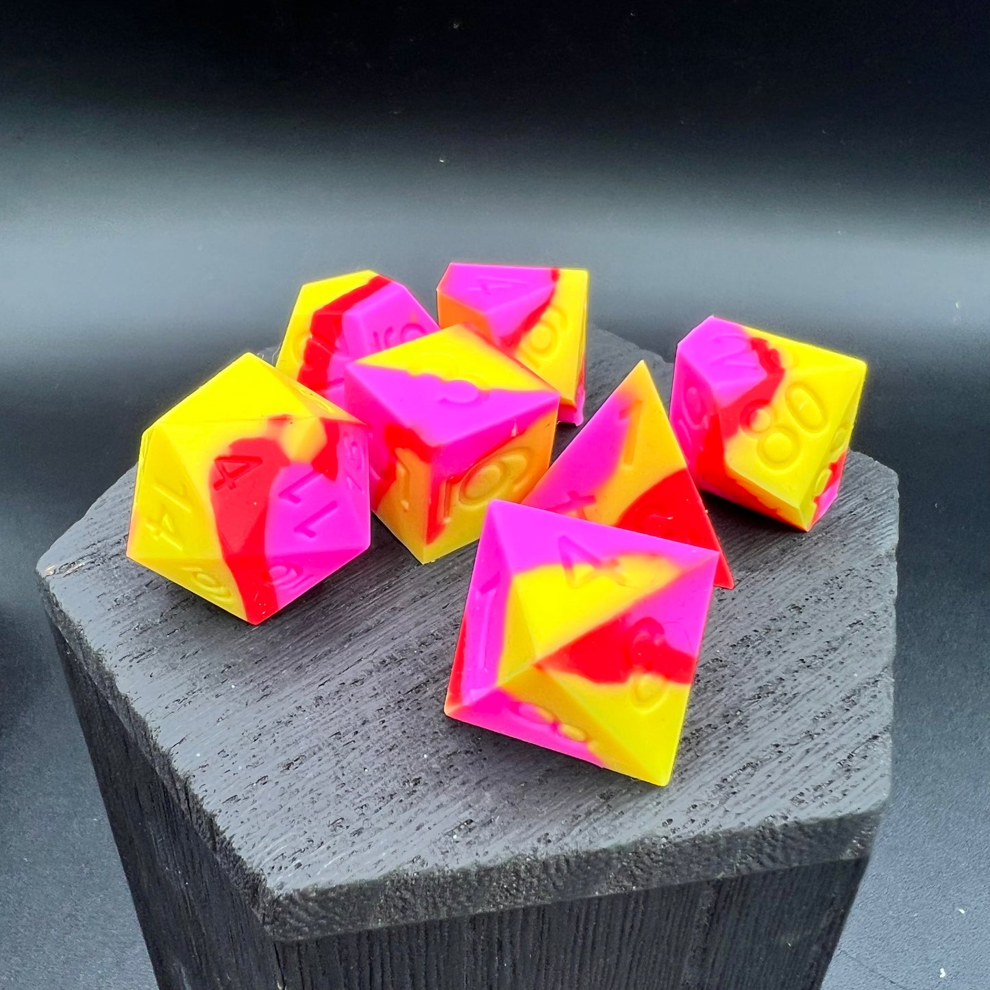 Yellow, Pink, and Red Silicone Dice