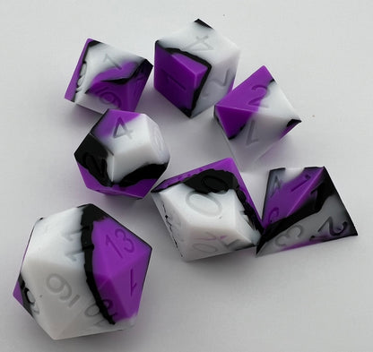 Purple, White, and Black Silicone Dice
